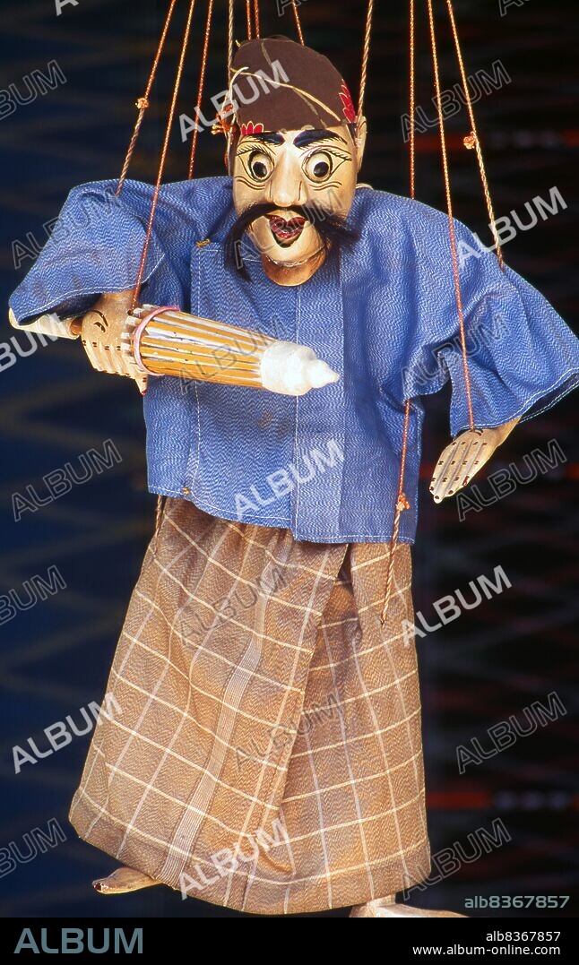 Burma / Myanmar: A traditional Burmese puppet (Yoke thé) on sale, Bogyoke Aung San Market, Yangon (Rangoon). Yoke thé (lit. miniatures) is the Burmese name for marionette puppetry. Although the term can be used for marionettery in general, its usage usually refers to the local form of string puppetry. Like most of Burmese refined art, Yoke thé performances originated from Royal patronage and were gradually adapted for the wider populace. Yoke thé are almost always performed in operas.