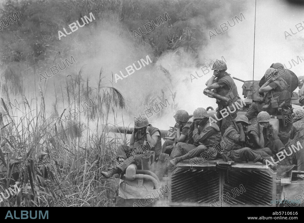 Indochina wars / Vietnam War 1964-75.-Combat southeast of Phu Bai: U.S. Marines, on a M-48 Tank, fire with 90mm guns at enemy positions.-Photo(Cpl. D.I.Fisher, U.S.Marine Corps) 3.4.1968.