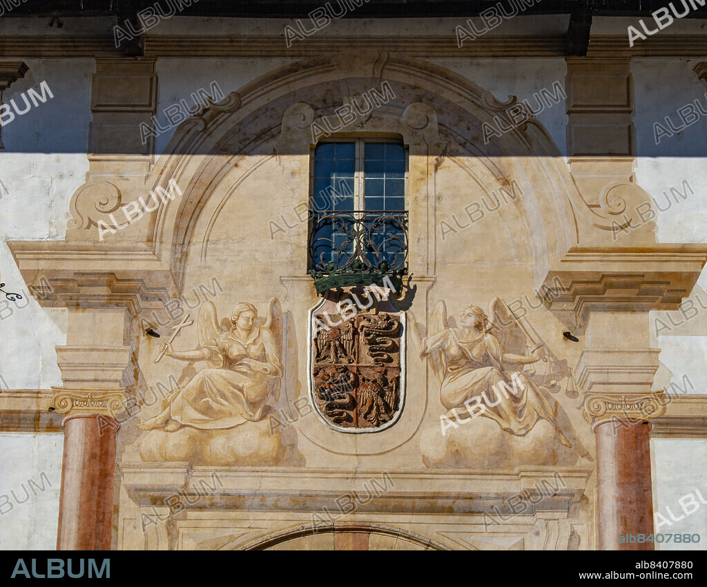 Lombardy, Italy, Europe. The Charterhouse of Pavia, in italian Certosa di Pavia (Gratiarum Carthusia - Monastery of Santa Maria delle Grazie) is a historic monumental complex that includes a monastery and a sanctuary. It is located in the homonymous municipality of Certosa di Pavia, a town some kilometers north of the provincial capital. Pavia. The main door with th coat of arms and decorations with angels.