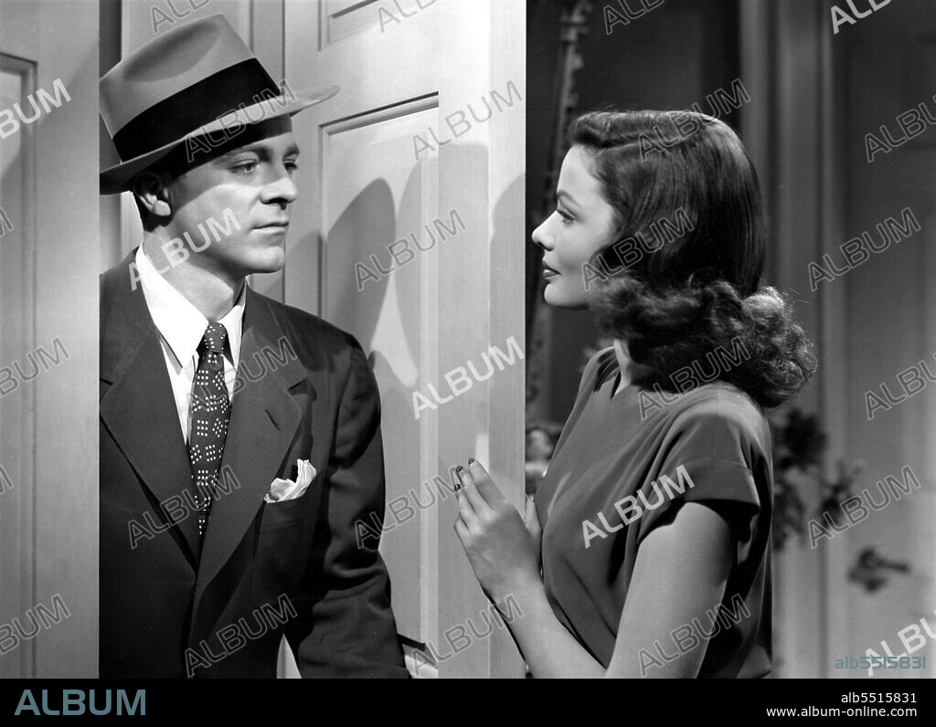 DANA ANDREWS y GENE TIERNEY en LAURA, 1944, dirigida por OTTO PREMINGER. Copyright Twentieth Century-Fox.