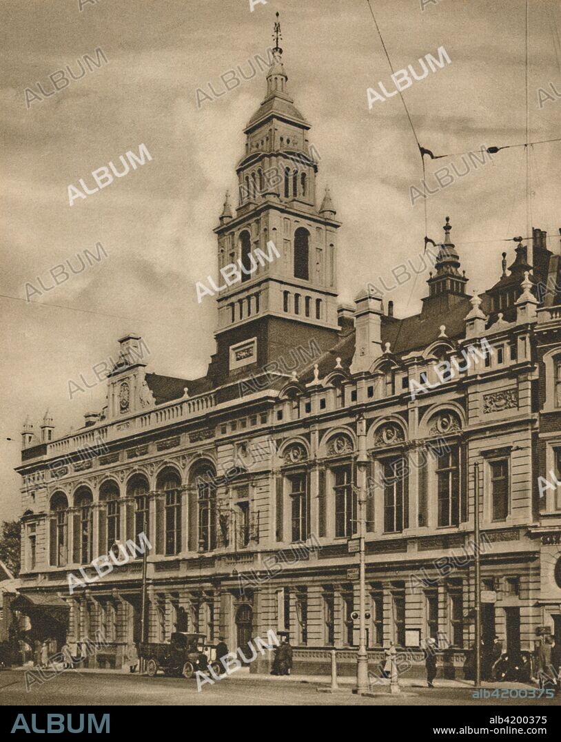 'Hammersmith Town Hall from Hammersmith Broadway', c1935. Town Hall building in Hammersmith, west London, designed by JH Richardson and opened in 1897. It was demolished in the 1960s. From "Wonderful London, Volume 3", edited by Arthur St John Adcock. [The Fleetway House, London, c1935].