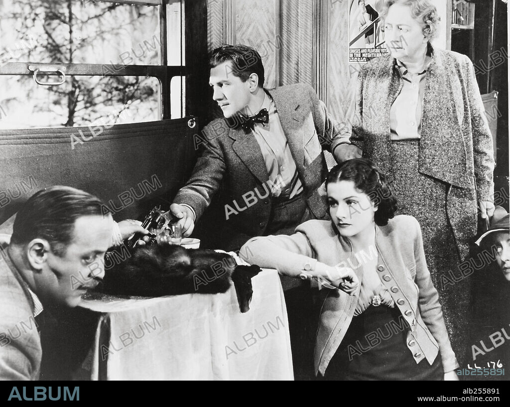 DAME MAY WHITTY, MARGARET LOCKWOOD and MICHAEL REDGRAVE in THE LADY VANISHES, 1938, directed by ALFRED HITCHCOCK. Copyright GAINSBOROUGH FILMS.