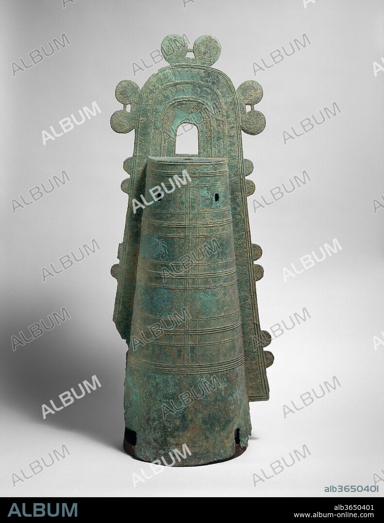 Dotaku (Bronze Bell). Culture: Japan. Dimensions: H. 43 1/2 in. (110.5 cm). Date: 1st-2nd century.
Produced during the late Yayoi period, the distinctive clapperless Japanese bronze bells known as dotaku are thought to derive from earlier, smaller Korean examples that adorned horses and other domesticated animals. Dotaku were buried, singly, in pairs, and in large groups--occasionally with bronze mirrors and weapons--in isolated locations, often on hilltops, perhaps to ensure a community's agricultural fertility. Later dotaku had relatively thin walls and would not have resonated, so it assumed their purpose was primarily ritual.