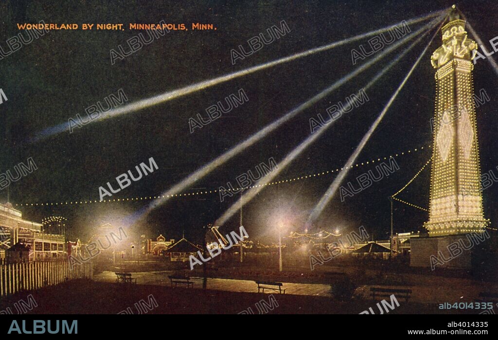 Wonderland Amusement Park by night, Minneapolis, Minnesota, USA, c1908. Vintage postcard showing the rides outlined in tiny lights and the tower completely lit up. The amusement park was open from 1905 until 1911.