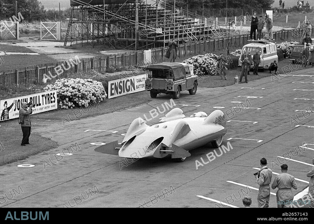 Donald Campbell's Land Speed Record car Bluebird with air brakes extended at press call before public test at Goodwood Bluebird, Goodwood, England, Easter Monday, 1960.