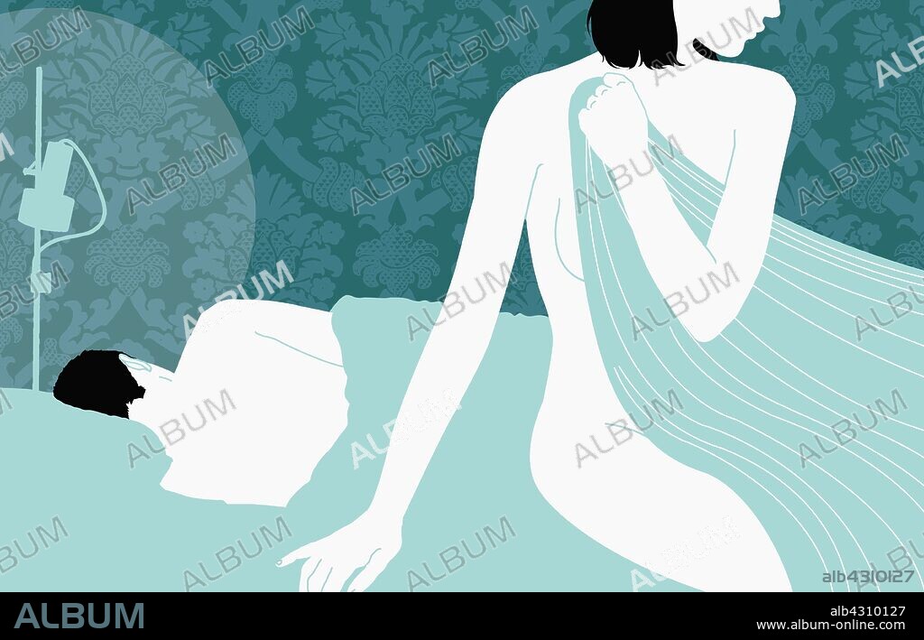 Nude woman sitting at edge of bed with man sleeping in background.