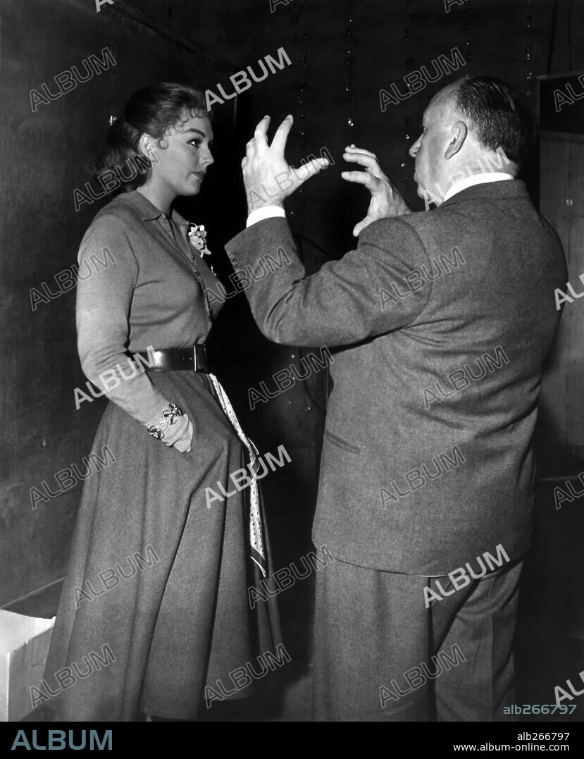 ALFRED HITCHCOCK and KIM NOVAK in VERTIGO, 1958, directed by ALFRED HITCHCOCK. Copyright Alfred J. Hitchcock Productions.