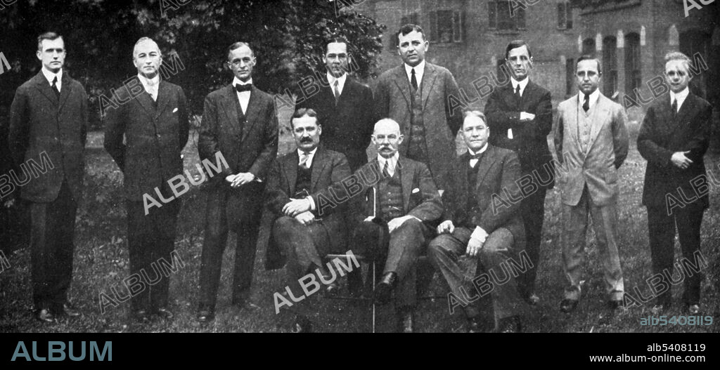 William Stewart Halsted (1852-1922), American surgeon, with the present and former members of his staff at the twenty-fifth anniversary of the opening of the Johns Hopkins Hospital, October, 1914. Standing (left to right): Roy D. McClure, Hugh H. Young, Harvey Cushing, James F. Mitchell, Richard H. Follis, Robert T. Miller, Jr., and George J. Heuer; sitting (left to right): John M.T. Finney, William S. Halsted, Joseph C. Bloodgood.