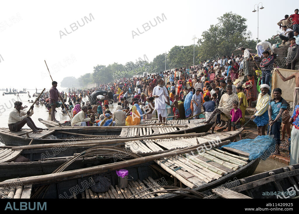 Wooden ferryboats with bamboo decking used to take people across the River Ganges between Patna and Sonepur Cattle Fair, Bihar, India, Asia.
