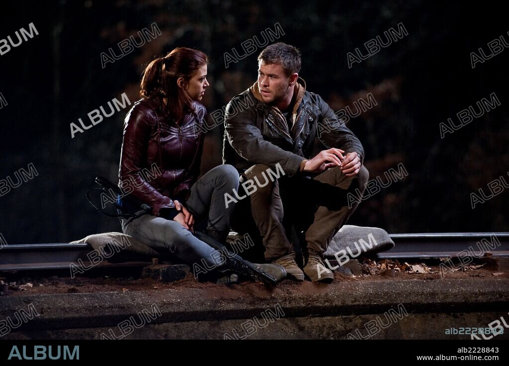 ADRIANNE PALICKI and CHRIS HEMSWORTH in RED DAWN, 2012, directed by DAN BRADLEY. Copyright FILMDISTRICT.