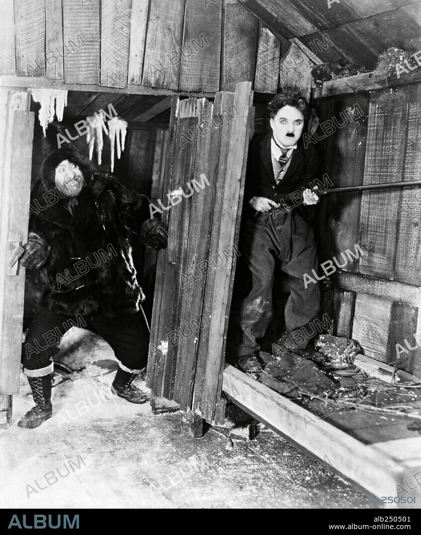 CHARLIE CHAPLIN and MACK SWAIN in THE GOLD RUSH, 1925, directed by CHARLES CHAPLIN. Copyright UNITED ARTISTS.