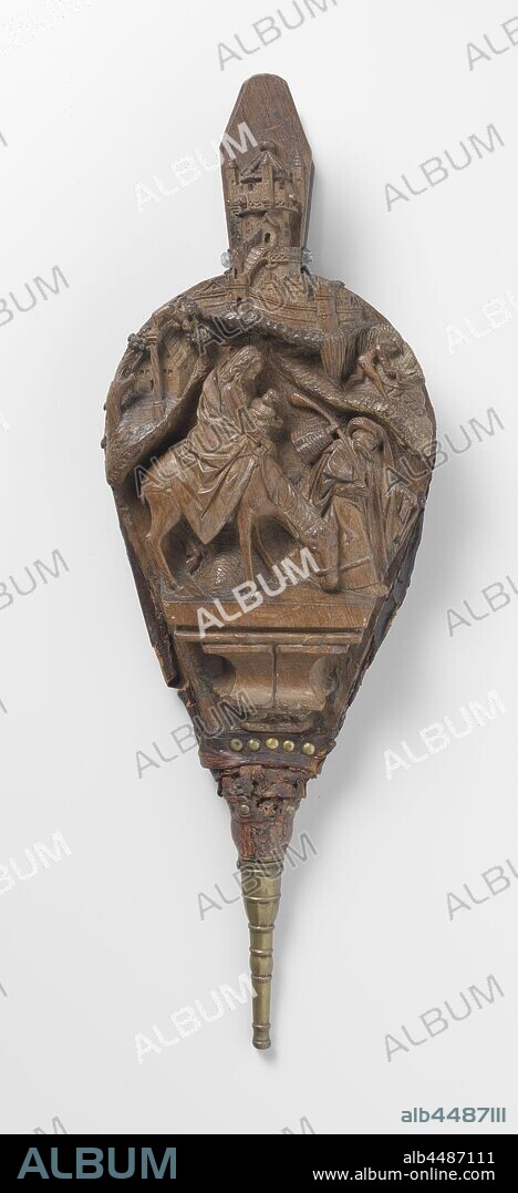 Pair of Bellows with the Flight into Egypt, Consists of a front and back leaf, both half round at the top with a protrusion as a handle and taper down into a copper blowpipe. On the cover page the Flight to Egypt above a profiled console, against which, in view of the bands depicted there, two coats of arms have been placed. Mary is turned away from the viewer on the donkey, which goes to the right and is led by Joseph. She has wrapped her wide cloak around herself and the child who looks up to her and holds it in her left arm, she has a slip of the cloak in her right hand. Joseph walks ahead with great strides and looks after her. He holds the rein in the left hand and a staff on the right, which rests on the shoulder and on which hangs a basket. He wears a hood and cloak, which is folded back over the shoulder, releasing part of the tunic and sleeves. The hilly landscape at the top left shows, among trees, a farmstead, for which there is a column with a falling idol, to the right in the field a man mowing wheat with a sickle. Above both scenes a walled city with houses and a tower-shaped structure, to which a staircase leads. This structure consists of two corridors with floors surrounded by battlements, the top of which still has turrets and gargoyles. In the flat back sheet an opening with gothic tracery, the brass blowpipe has a simple profile, the flight into Egypt: Mary, Joseph, the child (and sometimes others) on their way, Mary usually riding on an ass, Master of the Utrecht Stone Female Head (attributed to workshop of), Utrecht, c. 1510, bladen, blaaspijp, leather, h 61.5 cm × w 22 cm × d 7.5 cm.