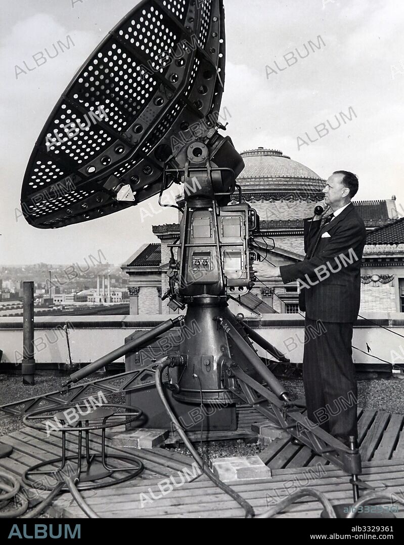Dr. Serge A. Korff, well known cosmic ray physicist of New York University, telephones instruction from Rawin antenna being tested for later use in cosmic ray balloons flights.