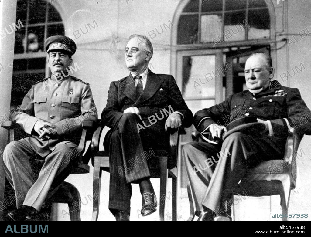 Allied Leaders Confer In Teheran -- Marshal Josef Stalin, President Franklin D. Roosevelt and Prime Minister Winston Churchill are shown on the port 100 of the Russian Embassy, at Teheran, following their historic conferences. His tunic while Prime Minister Churchill is in the uniform of a RAF Air Marshall. May 12, 1943. (Photo by ACME).
