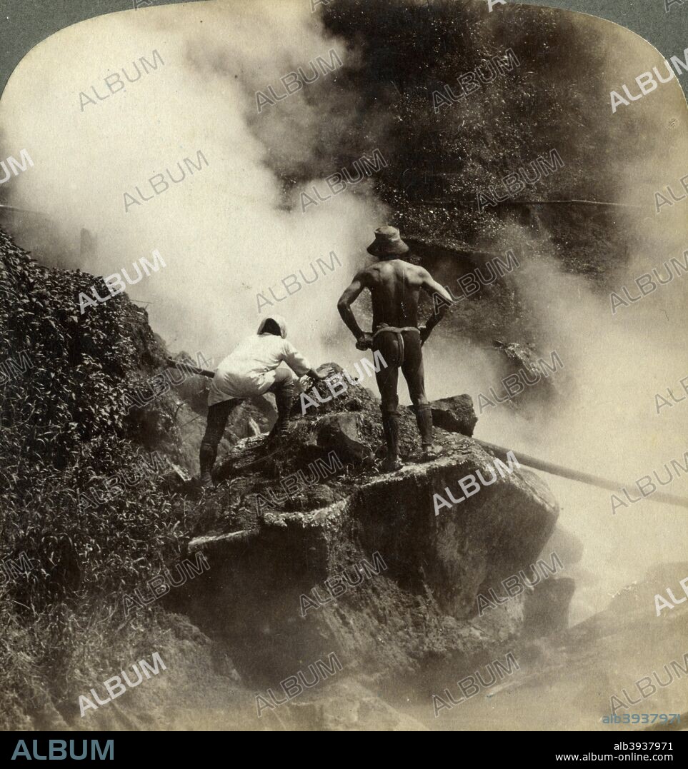 Watching an eruption of steam and boiling mud halfway up the volcano of Aso-san, Japan, 1904. Mount Aso (Aso-san), on the island of Kyushu, is the largest active volcano in Japan. Its caldera is 25 kilometres across at its widest point. Stereoscopic card. Detail.