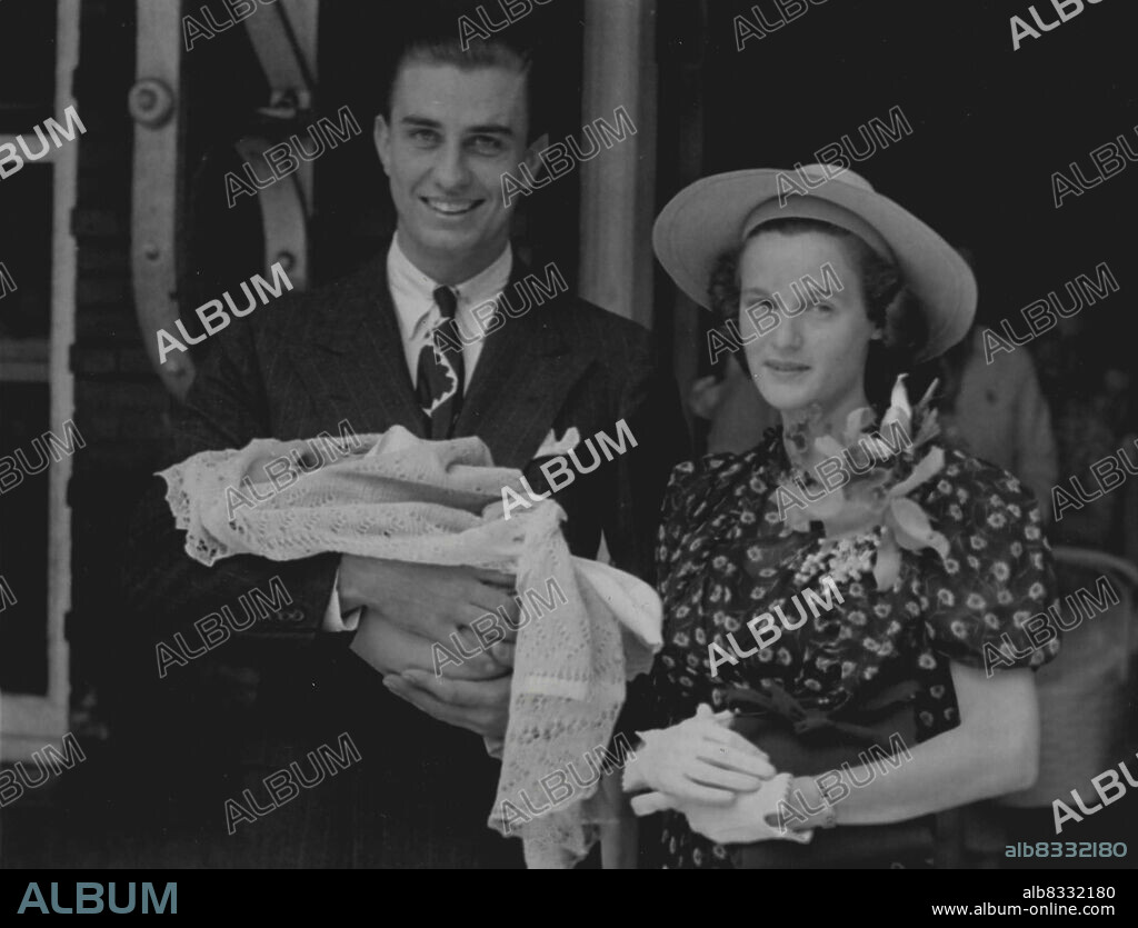 First Public Appearance Of Newest Roosevelt.His Beaming parents standing by, Franklin D. Roosevelt, is shown here in his first public appearance since his birth on July 19, as his dad and Mother. The Former Ethel Dupont, left the lying in hospital here, Aug. 6, to take him to "Owl's Nest", the Wilmington, Del., home of Mr. and Mrs. Eugene DuPont, his maternal grandparents. June 8, 1938. (Photo by Acme).