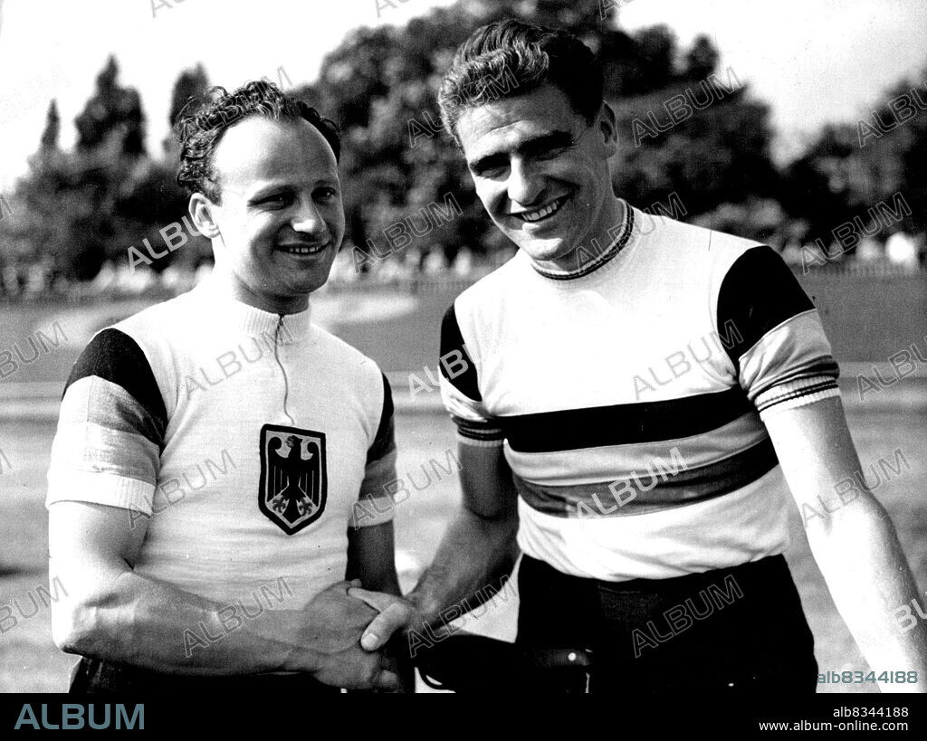 Great Britain V. Germany Professional Cycle Racing and Olympic Trials at Herne Hill:Sid Patterson, the popular Australian Rider, being congratulated by German Sprint Champion, Warner Potzernheim after Patterson (right) had broken the half Mile unpaced flying start record by 8 of a second established by Reg Harris on the track in 1949.Australian professional cyclist Sid Patterson is congratulated by German sprint champion Werner Potzernheim after Patterson has broken the half-mile unpaced flying start record by 8 sec at Herne Hill, London. May 17, 1952. (Photo by Paul Popper).