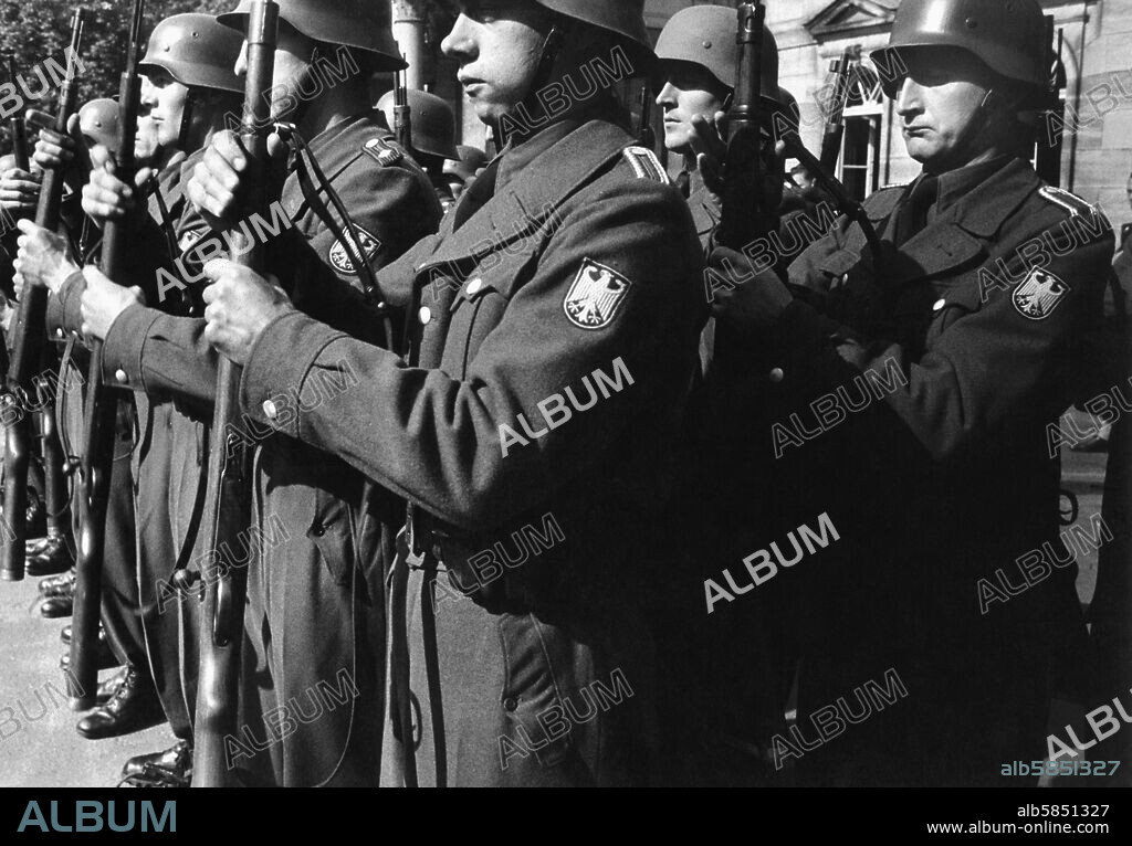 The "Bundesgrenzschutz" (Federal Frontier Guards), a police unit of 10.000 established in 1951, is West Germany's first military unit after World War II. 
Rifle drill. 
Coburg, 1953.