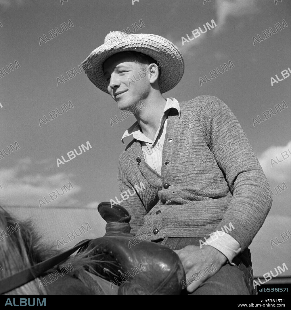 Cowboy on Ranch Horse in Corral at Quarter Circle U, Brewster-Arnold Ranch Company, Birney, Montana, USA, Marion Post Wolcott, U.S. Farm Security Administration, August 1941.