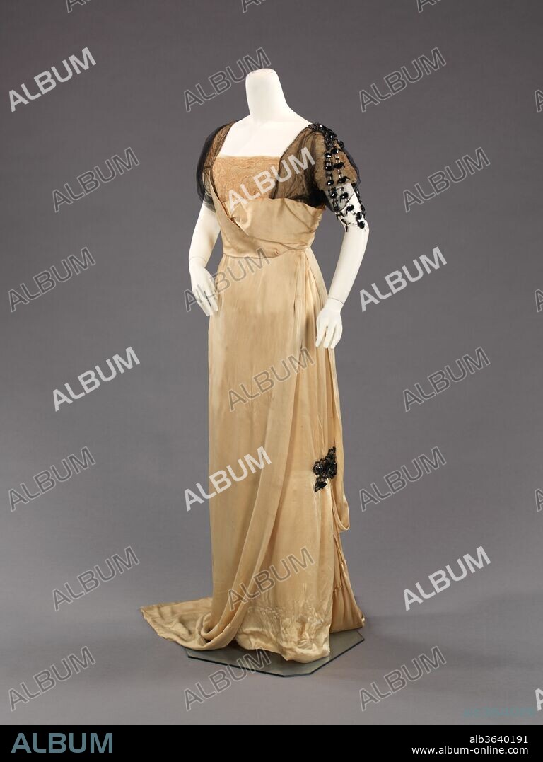 Evening dress. Culture: French. Designer: Paul Poiret (French, Paris 1879-1944 Paris). Date: 1912-14.
This is a rare early example of Poiret's work, from the height of his influence in fashion.  At the time, Poiret promoted a neoclassical silhouette and designs inspired by the East.  
Paul Poiret was the son of a textile distributor with the ambition and creativity to become a fashion designer.  Brief employment for Jacques Doucet (1853-1929) and the House of Worth (1858-1956) led him to open his own dressmaking shop near the Place de l'Opèra in 1903 at the age of 24.  His first two design albums, "Les Robes de Paul Poiret" drawn by Paul Iribe (1883-1935) in 1908 and "Les Choses de Paul Poiret" created by Georges Lepape (1887-1971) in 1911, not only changed the concept of fashion marketing and illustration, they prophesied the pivotal transition women made from the corseted silhouette of the Victorian age into the natural and sleek un-corseted form of the modern era.  The tubular shape and folkloric trimmings he presented were continuously part of the Poiret vocabulary as well as draping, which proved ingenious in the time of tailoring and drafting.