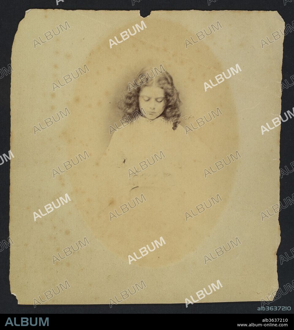 LEWIS CARROLL (ECRIVAIN). Edith Liddell Seated Beside a Vase of Foxgloves. Artist: Lewis Carroll (British, Daresbury, Cheshire 1832-1898 Guildford). Dimensions: Sheet: 6 1/4 × 5 3/4 in. (15.9 × 14.6 cm)
Image: 5 1/4 × 3 3/4 in. (13.3 × 9.5 cm). Person in Photograph: Person in photograph Edith Mary Liddell (British, 1854-1876). Date: 1860.
