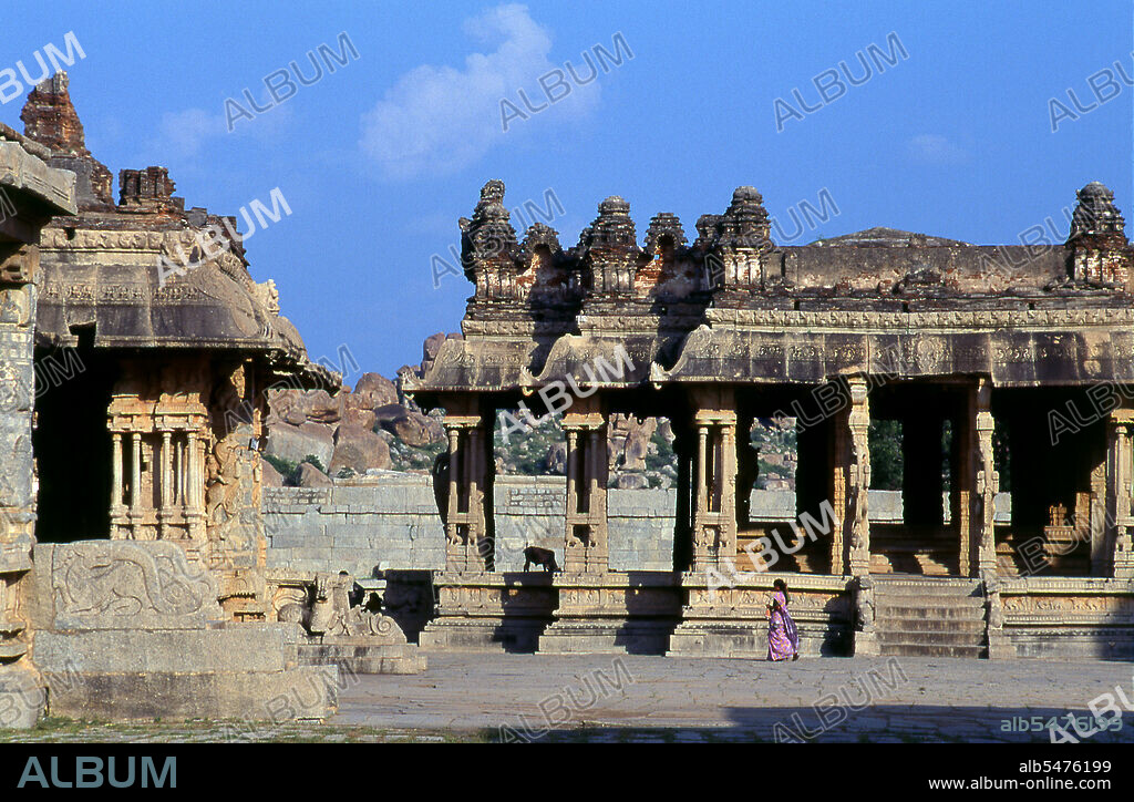The Vittala Temple, built in the early 16th century, is devoted to the Hindu god Vithoba (also known as Vitthala and Panduranga), an incarnation of Vishnu or his avatar Krishna. Hampi is a village in northern Karnataka state. It is located within the ruins of Vijayanagara, the former capital of the Vijayanagara Empire. Predating the city of Vijayanagara, it continues to be an important religious centre, housing the Virupaksha Temple, as well as several other monuments belonging to the old city.
