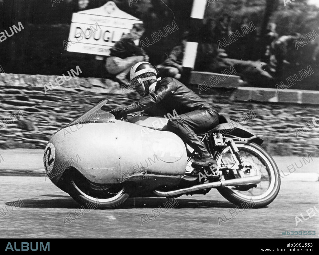 Bill Lomas at Governor's Bridge, Isle of Man Junior TT, 1955. Lomas won the race on his Moto-Guzzi. He also won the Lightweight (250 cc) race on an MV Agusta that year.