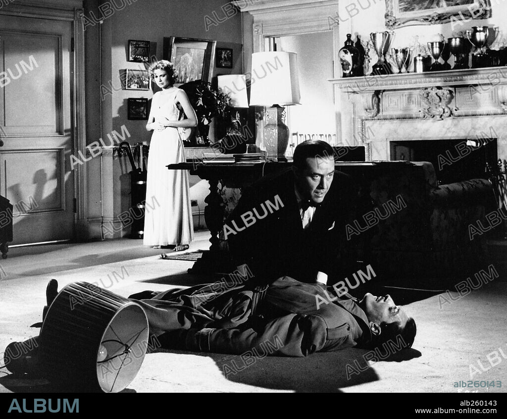 ANTHONY DAWSON, GRACE KELLY and RAY MILLAND in DIAL M FOR MURDER, 1954, directed by ALFRED HITCHCOCK. Copyright WARNER BROS.