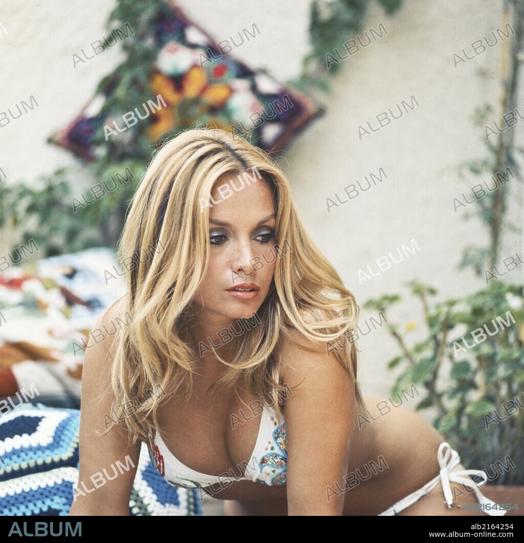 Half-length portrait of Maria Giovanna Elmi wearing a bikini. Wearing a revealing embroidered bikini, the Italian announcer and presenter Maria Giovanna Elmi protrudes and glances down; name-called La Fatina (The Fairy) because of her sweet features and the songs she pressed for the children, she has been a renowned character of the Italian television from the Seventies to the Eighties. Italy, Seventies.