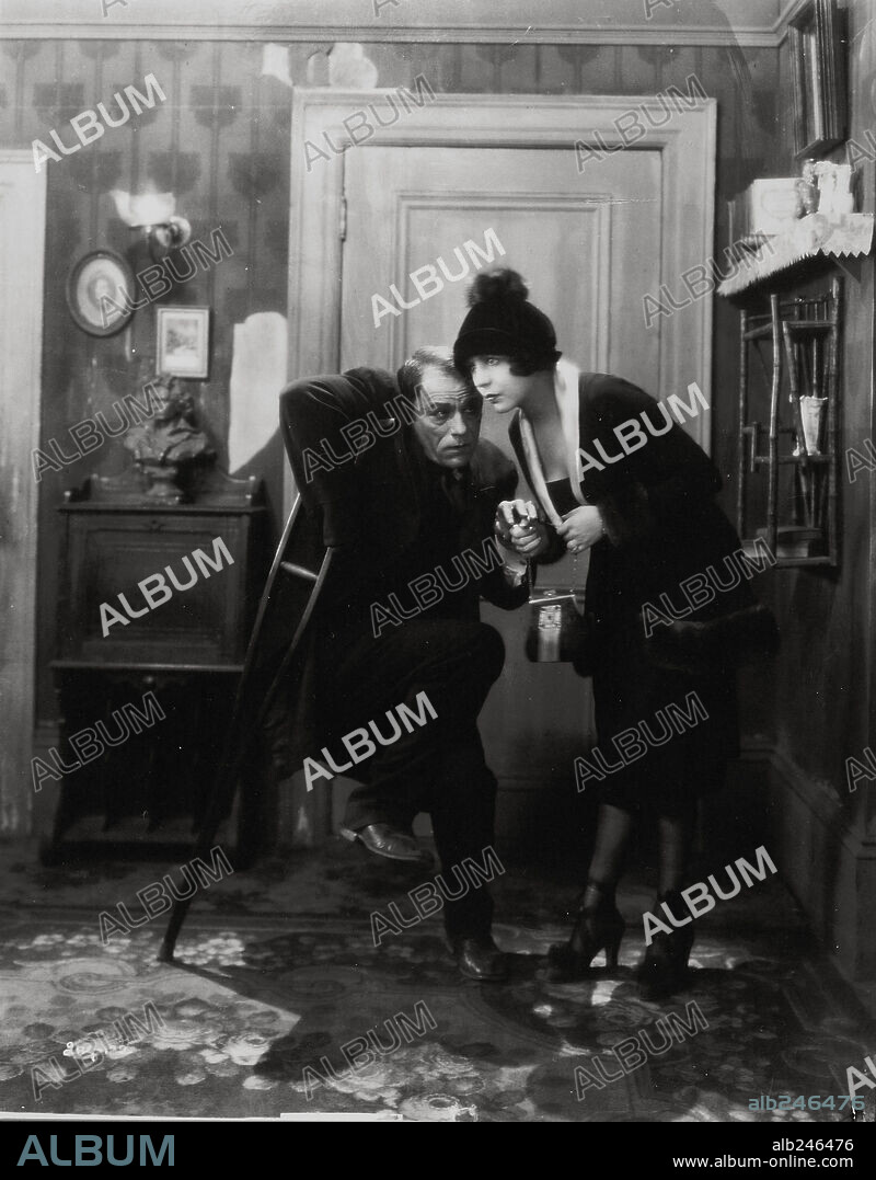 LON CHANEY and RENEE ADOREE in THE BLACKBIRD, 1926, directed by TOD BROWNING. Copyright M.G.M.