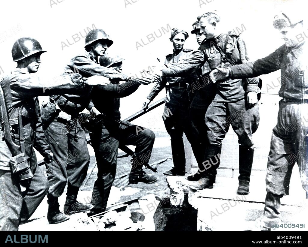 Meeting of American and Russian soldiers near Torgau, Germany, World War II, 25 April 1945. Torgau, a town on the banks of the River Elbe, was the point where the US Army first made contact with the Red Army advancing from the opposite direction.