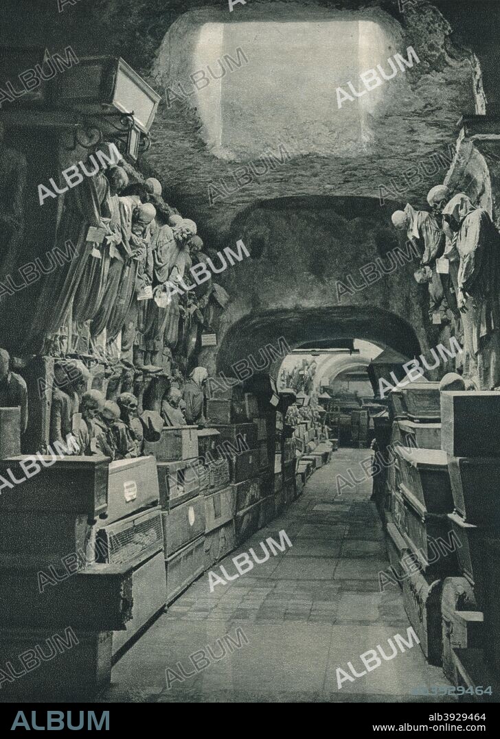 Catacombs of the Capuchins, Palermo, Sicily, Italy, 1927. The Capuchins are an order of friars in the Catholic Church, among the chief off-shoots of the Franciscans. The catacombs began to be used in the 16th century when the Capuchin monastery of Palermo ran out of space in its cemetery and began to excavate crypts beneath the monastery. Originally the catacombs were only intended to be used to bury the dead friars, but as it came to be regarded as a status symbol, local notables began to be interred there as well and the catacombs were maintained by their donations. The last burials took place in the 1920s. From Italien in Bildern, by Eugen Poppel [August Scherl, Berlin, 1927].