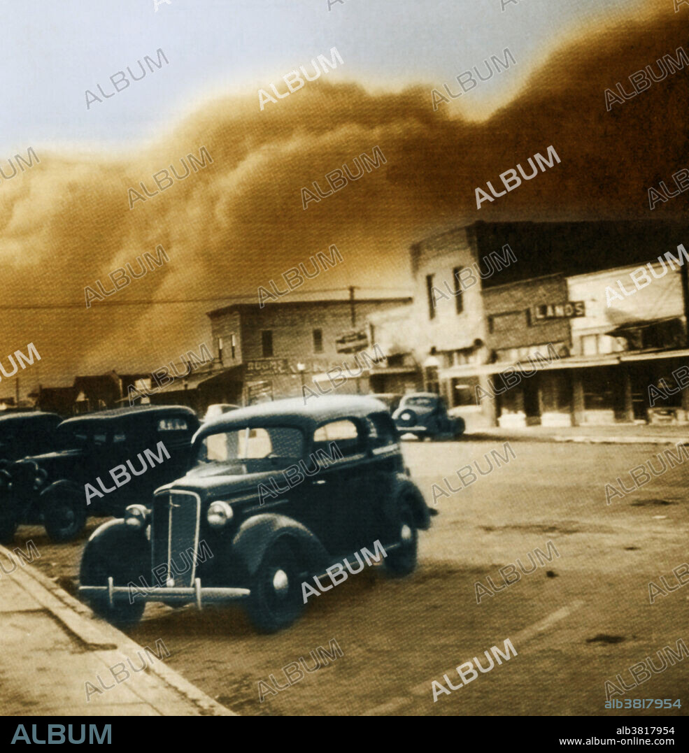 Elkhart, Kansas, crouches before one of the terrifying black blizzards that struck the towns in the Dust Bowl throughout the 30s. Elkhart prided itself on being the 'Broomcorn capital of the Nation', but for 10 years it harvested little but dust. By 1933, the storms had reduced the Elkhart wheat crop to only 37 percent of its normal size. Visibility was sometimes limited to 20 feet for hours. The dirt did not stop blowing until the eve of the second world war. Unidentified photographer, May 21, 1937. The Dust Bowl of the 1930's proved to be an agricultural, ecological, and economic disaster in the Great Plains region of North America.