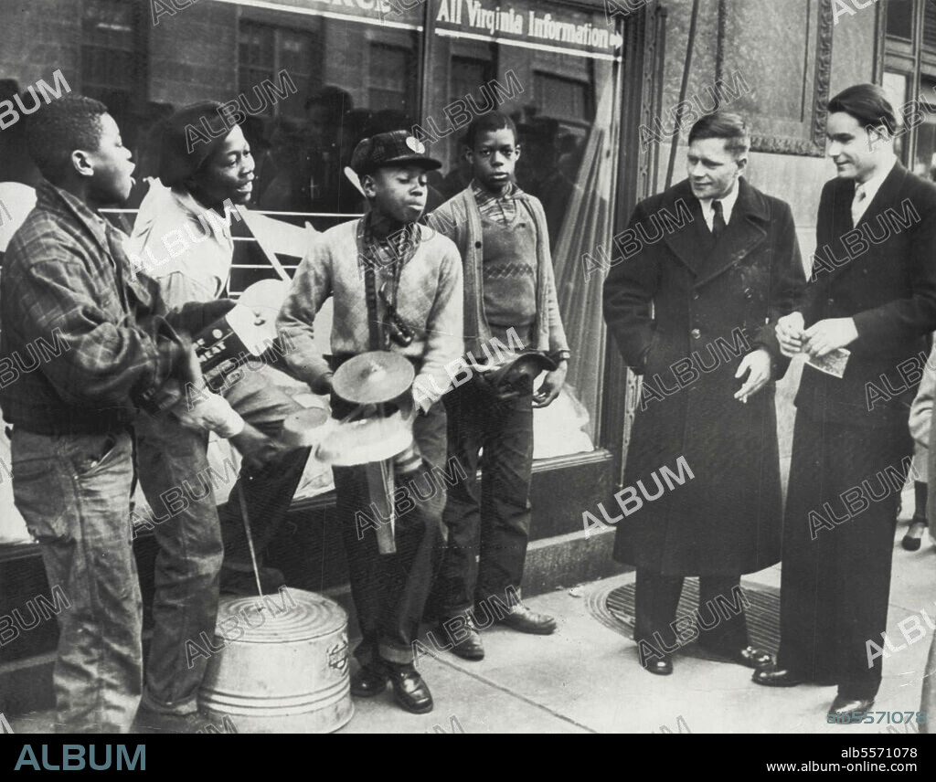 Russians Listen To Washboard Jive -- Russian flyers Anatol Barsov (left) and Peter Pirogev (right) fascinated by southern jive by the four boys known as the 'Ramblers, who hold forth on a Richmond street corner. February 5, 1949. (Photo by AP Wirephoto).