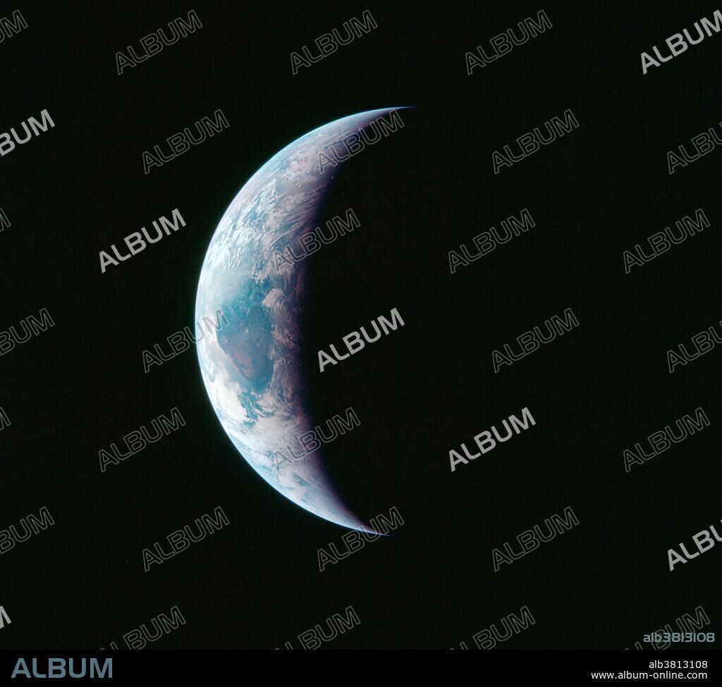 One-third of the Earth's sphere illuminated showing a portion of East Africa, with Earth's terminator and sunglint as photographed from the Apollo 11 spacecraft during its first lunar landing mission, July 16-24, 1969.