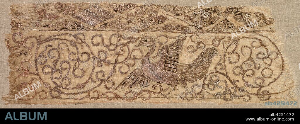 Embroidered fragment with bird among vines, 1100s. Iraq, Baghdad, Seljuq period. Plain weave: silk warp and cotton weft (mulham); embroidery, couched and split stitches: silk and metallic thread; overall: 7.3 x 21.6 cm (2 7/8 x 8 1/2 in.).