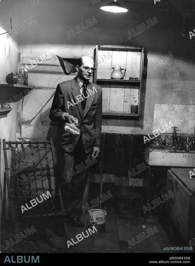 John Reginald Halliday Christie 1898-1953 a waxwork representing the murderer in the kitchen of 10 Rillington Place Notting Hill.
