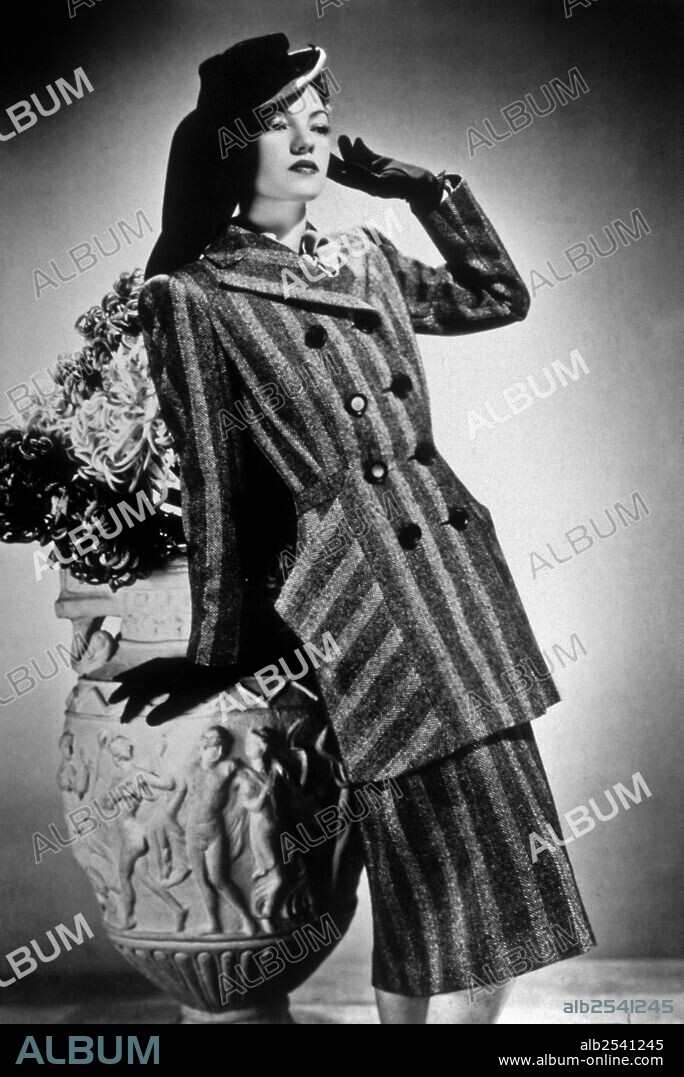 Fashion presentation by fashion designer Lucien Lelong, a tailor, in 1941 (in 1937-1947, Lucien Lelong was president of the Chambre Syndicale de la Haute Couture Parisienne, he opposed the Nazis request to relocate the fashion industry to Berlin and Vienna) -.
