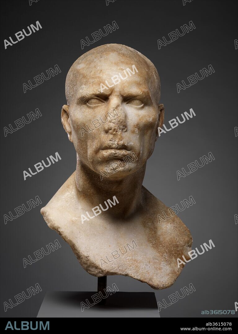 Marble portrait bust of a man. Culture: Roman. Dimensions: H. 17 7/16 in. (44.3 cm). Date: mid-1st century A.D..
This powerful portrait bust incorporates a large expanse of chest, a stylistic characteristic indicating that it was carved toward the middle of the first century A.D. Most surviving portraits worked in this hard realistic manner date to the first century B.C., but the style continued in fashion until the mid-first century A.D. and was revived intermittently thereafter.