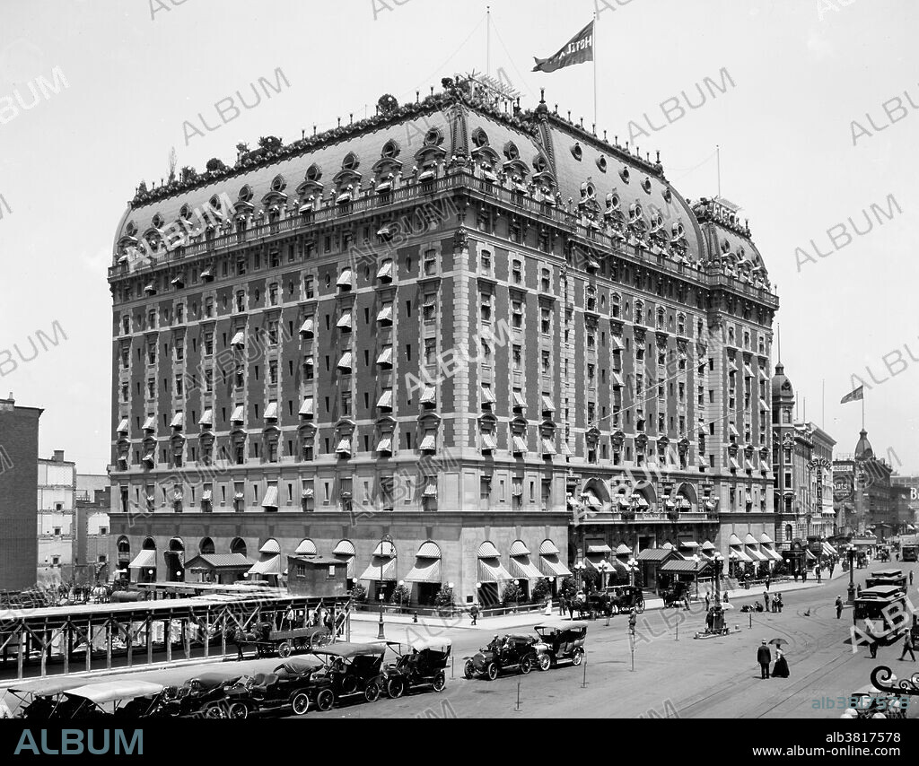 Hotel Astor was located in the Times Square area of Manhattan, in operation from 1904-67. The 35,000 square feet Hotel Astor was built in two stages, in 1905 and 1909-10, by the architects Clinton and Russell. Upon completion, the structure occupied an entire city block at a reported total cost of $7 million. Within its restrained exterior, the Astor featured a long list of elaborately themed ballrooms and exotic restaurants. The rooftop garden, with bandstand and observatory, was one of a number constructed in the city between 1880 and Prohibition. The Astor was an important element in the growth of Times Square and its character as an entertainment center. The Astor set the pattern for "a new species of popular hotels that soon clustered around Times Square, vast amusement palaces that catered to crowds with scenographic interiors that mirrored the theatricality of the Great White Way." It closed and was demolished in 1967. Photographed by the Detroit Publishing Company, 1908.