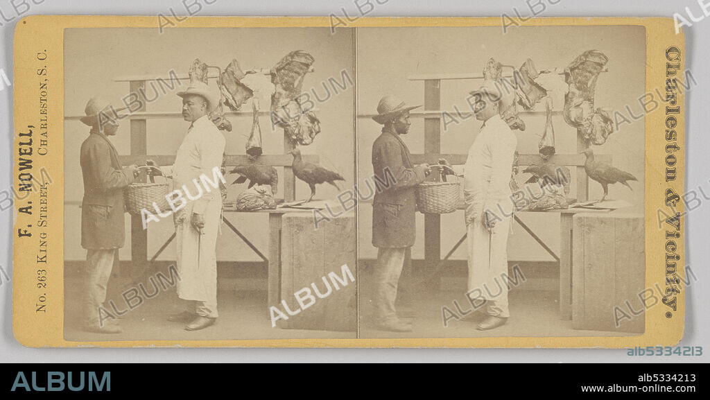 FRANK A. NOWELL. A reddish brown stereograph photograph of a butcher shop scene. In the image, two African-American men stand in front of a display of meat that appears to be staged in a photography studio. The man on the left is wearing khakis, a coat, and a hat with an up-turned rear brim. He is holding a wicker basket to the man in front of him. The man standing in the center of the image is dressed in white pants, a long-sleeved white shirt covered, white apron and a white hat. He is reaching out for the basket with one hand. In the background is a shelf with three rafters that feature two sets of ribs, an upended chicken, a flank, a leg, a hen, and a trussed package. At the far right of the photograph stand two butcher’s blocks. Printed in black text on the card on the left side is “F. A. NOWELL, / No. 263 KING STREET, CHARLESTON, S.C.” Printed in black text on the right side of the card is “Charleston & Vicinity.” Listed on the back of the card are “Catalogue of Views of Charleston and Vicinity,” with titles listed from #1-70. "No. 25. Market Scene" is underlined lightly in graphite.