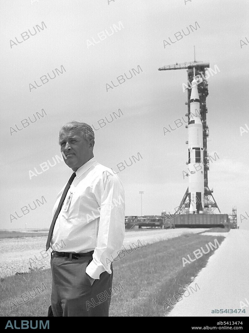 Wernher von Braun pauses in front of the Saturn V vehicle being readied for the historic Apollo 11 lunar landing mission. Wernher Magnus Maximilian Freiherr von Braun (March 23, 1912 - June 16, 1977) was a German-American rocket scientist, aerospace engineer, space architect, and one of the leading figures in the development of rocket technology in Nazi Germany during WWII and, subsequently, in the United States. He was the central figure in Germany's rocket development program, responsible for the design and realization of the V-2 combat rocket during WWII. After the war, he and select members of his rocket team were taken to the United States as part of the then-secret Operation Paperclip. Von Braun worked on the United States Army intermediate range ballistic missile (IRBM) program before his group was assimilated by NASA. Under NASA, he served as director of the newly formed Marshall Space Flight Center and as the chief architect of the Saturn V launch vehicle, the super-booster that propelled the Apollo spacecraft to the Moon. His crowning achievement was to lead the development of the Saturn V booster rocket that helped land the first men on the Moon in July 1969. In 1975 he received the National Medal of Science. He died of pancreatic cancer in 1977 at the age of 65.