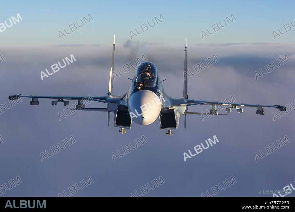 Sukhoi Su-30SM jet fighter of the Russian Navy flying in mid-air behind a refueling tanker, Kaliningrad Region, Russia.