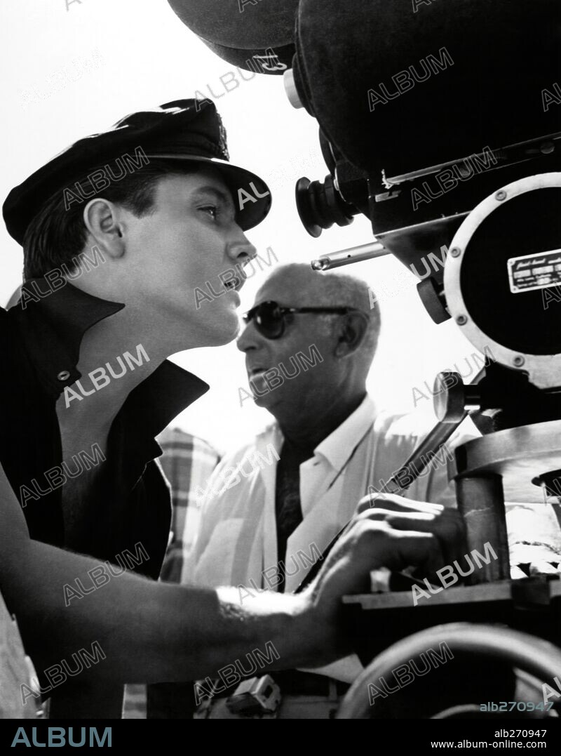 ELVIS PRESLEY and NORMAN TAUROG in GIRLS, GIRLS, GIRLS, 1962, directed by NORMAN TAUROG. Copyright PARAMOUNT PICTURES.