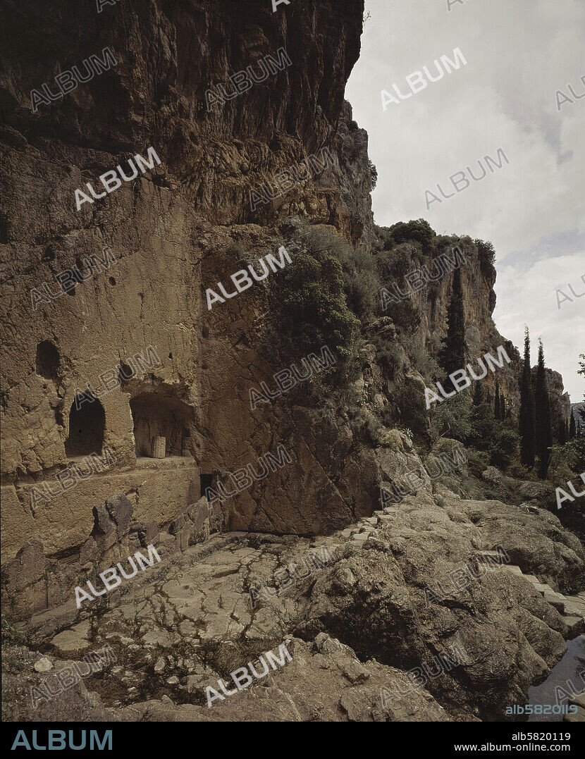 The Sacred Spring of Castalia, Delphi, issues from a deep crevasse in the Phaedrian Rocks below Mount Parnassos.