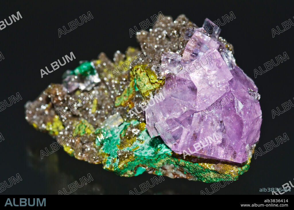 Calcite on a matrix of Malachite and Dolomite. Tsumeb Mine. Namibia, South Africa. Specimen Dimension: 4 x 2.5 cm.