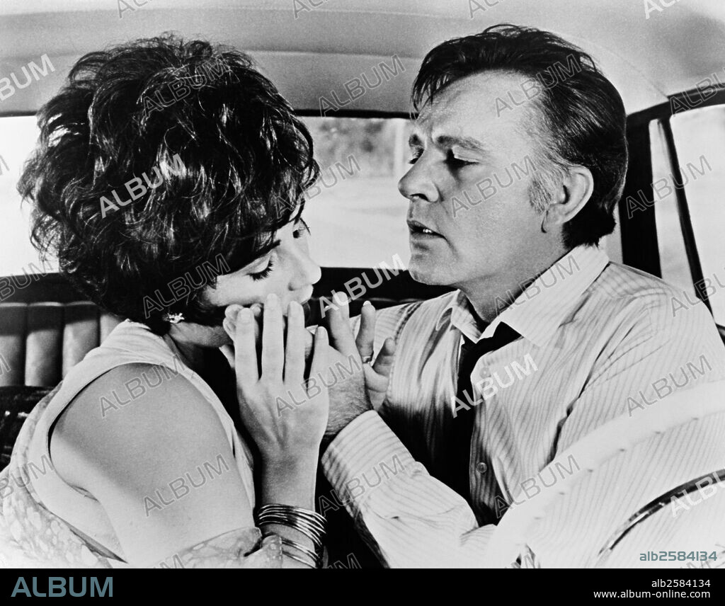 ELIZABETH TAYLOR and RICHARD BURTON in THE COMEDIANS, 1967, directed by PETER GLENVILLE. Copyright M.G.M.
