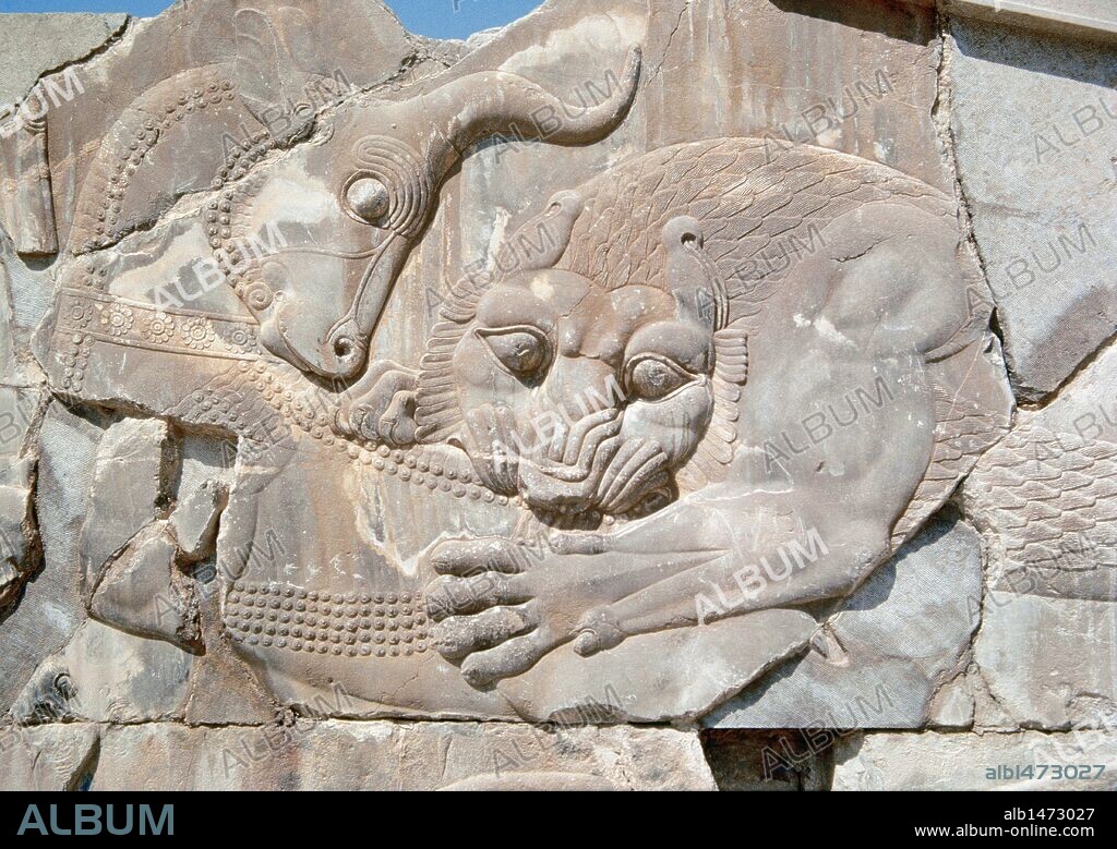 Persian art. Persepolis. Achaemenid period. Apadana Palace. First palace built under Darius I in the new capital, Persepolis. Stands decorated with reliefs. 6th century and 5th centuries BC. Lion and bull combat. Islamic Republic of Iran.