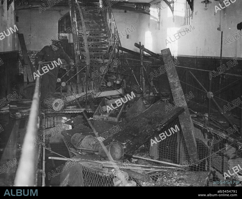 More "Glass House" Riots -- An interior view of the Wrecked detention barracks at Northallerton, Yorkshire, after the riot had been subdued yesterday March 1. Another riot broke out in an army "glass house" yesterday March 1, this time in the military detention barracks at Northallerton, Yorkshire, which were Wrecked and set on fire by soldiers service sentences of imprisonment. The Olivia fire service was called in to deal with the blaze but their Wreck was hindered by rioters throwing bricks and slates at them. March 13, 1946. (Photo by Associated Press Photo).