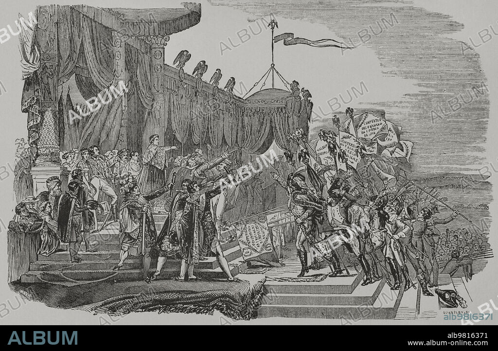 Primer Imperio Francés. Ejército napoleónico. Distribución de las águilas imperiales a los regimientos franceses. Se trataba de unos estandartes, con la figura de un águila imperial francesa, que la Grande Armée de Napoleón llevaba a las batallas. Ceremonia militar de la distribución de los estandartes del águila organizada por Napoleón, en el Campo de Marte, el 5 de diciembre de 1804 tras su llegada al poder como emperador de los franceses. Grabado por Quartlev. Los Héroes y las Grandezas de la Tierra. Tomo V. 1855.